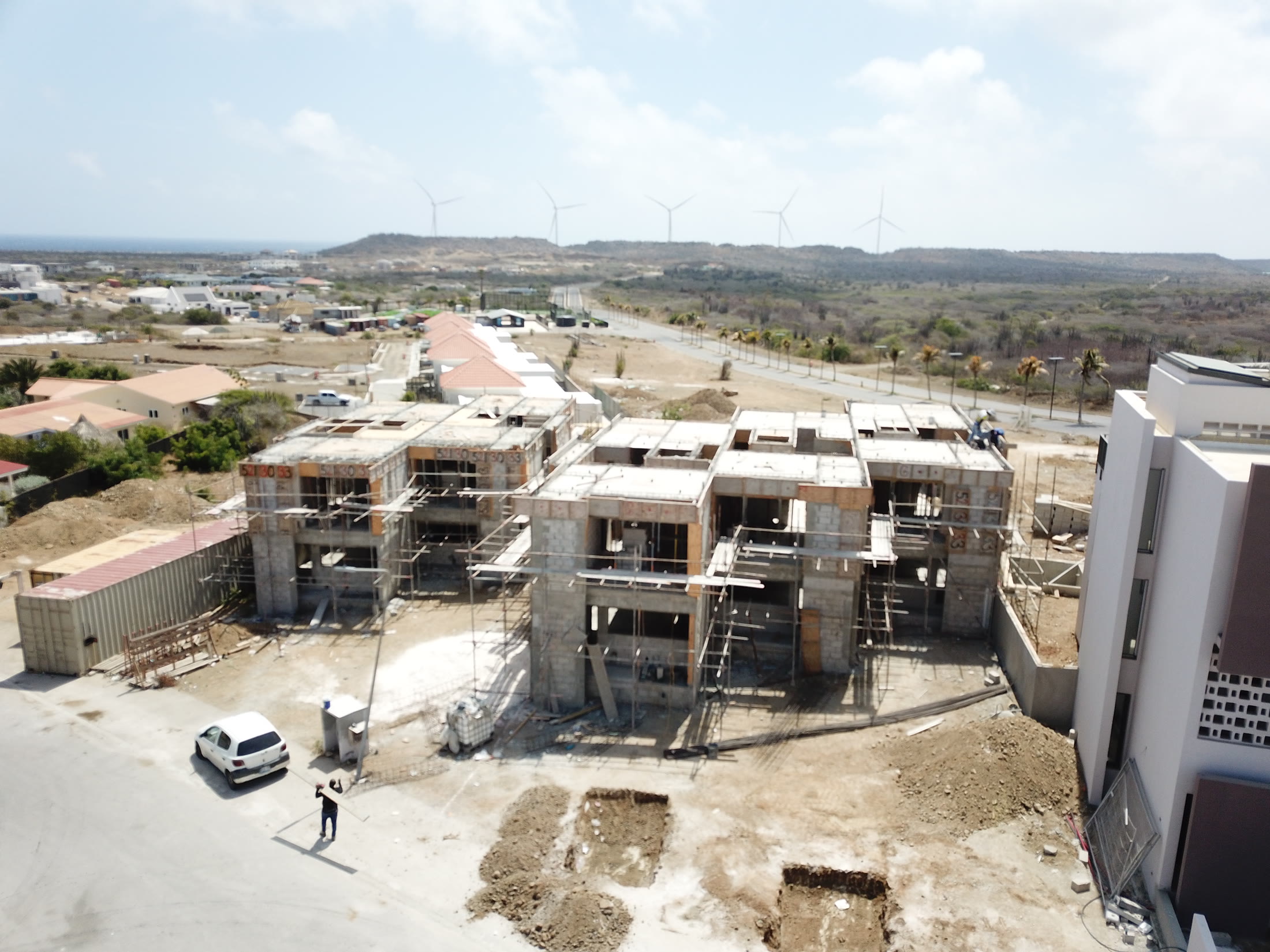 Completed homes beside blocks still under construction