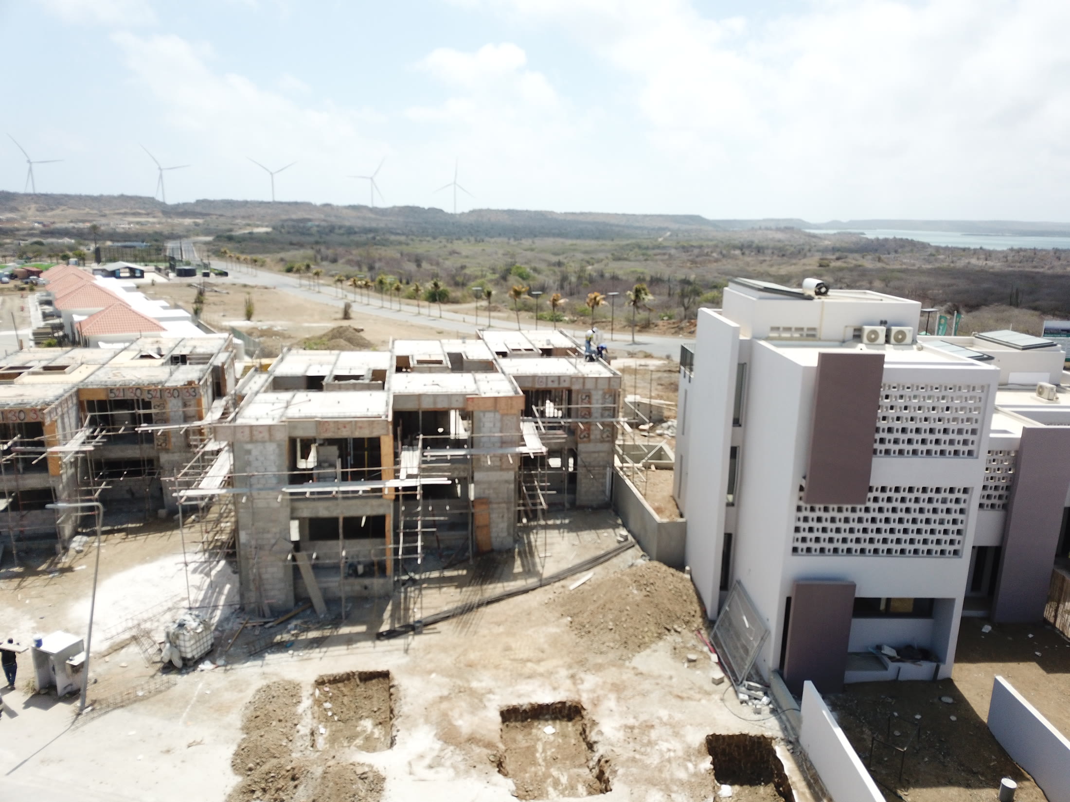 Aerial view of the development with the coast beyond